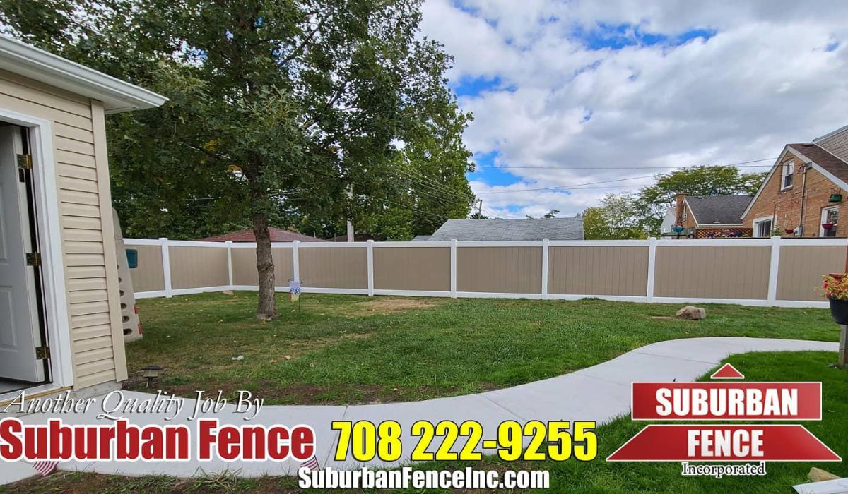 a yard with a wooden fence