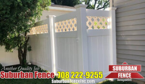 A white vinyl fence by Suburban Fence