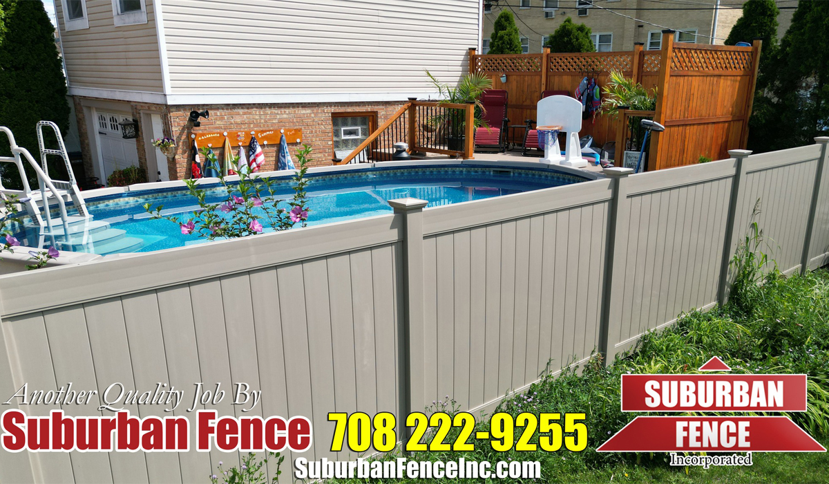a pool behind a vinyl fence