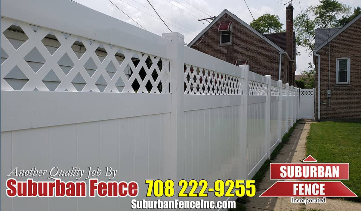White vinyl privacy fence in the backyard.