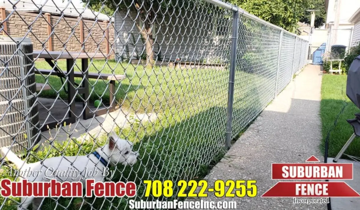 Custom chain-link fences installed by Suburban Fence for backyard security, featuring a durable metal design.