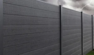 Black horizontal panel fence built with durable storm-proof fencing materials under cloudy, lightning-filled stormy sky.