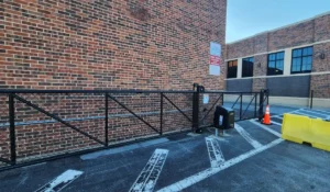 Automated chain-link gate for commercial property protection in Chicago, ensuring secure access and compliance for businesses.