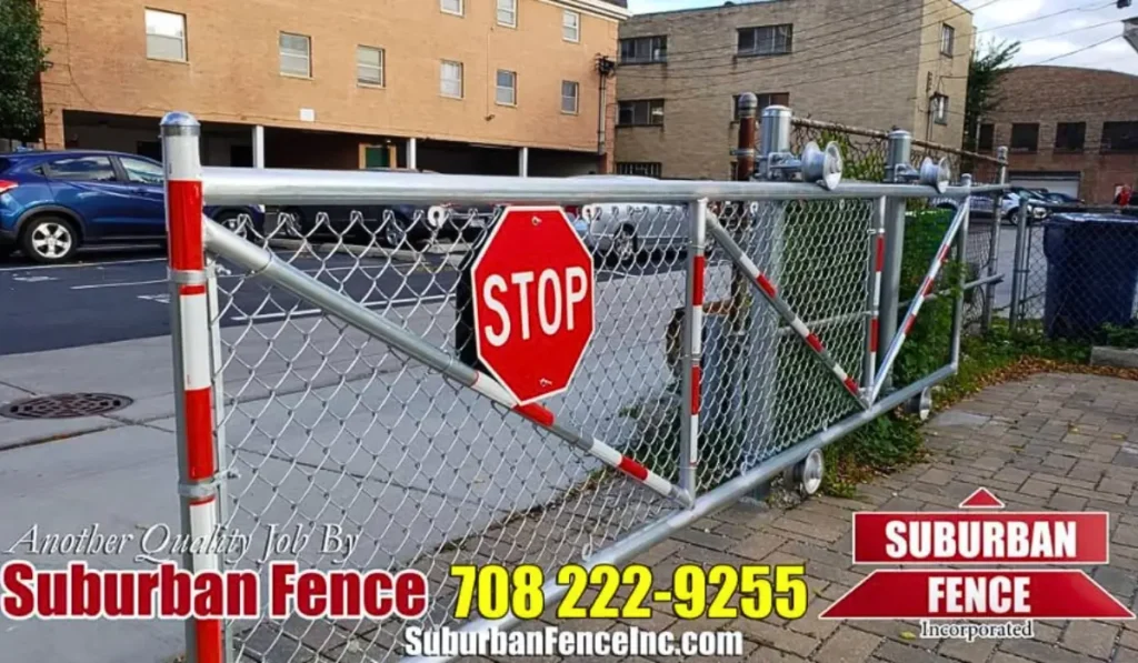 Chain link warehouse fencing in Chicago with a mounted stop sign for controlled pedestrian and vehicle access, professionally installed by Suburban Fence.