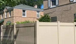 Spring fence installation showing vinyl privacy fence panels in Chicago backyard with clean alignment and sunny conditions.