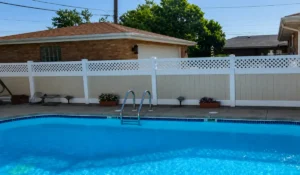 Fence Pool-Ready vinyl fence surrounding residential pool area supporting safety, privacy, and summer compliance.